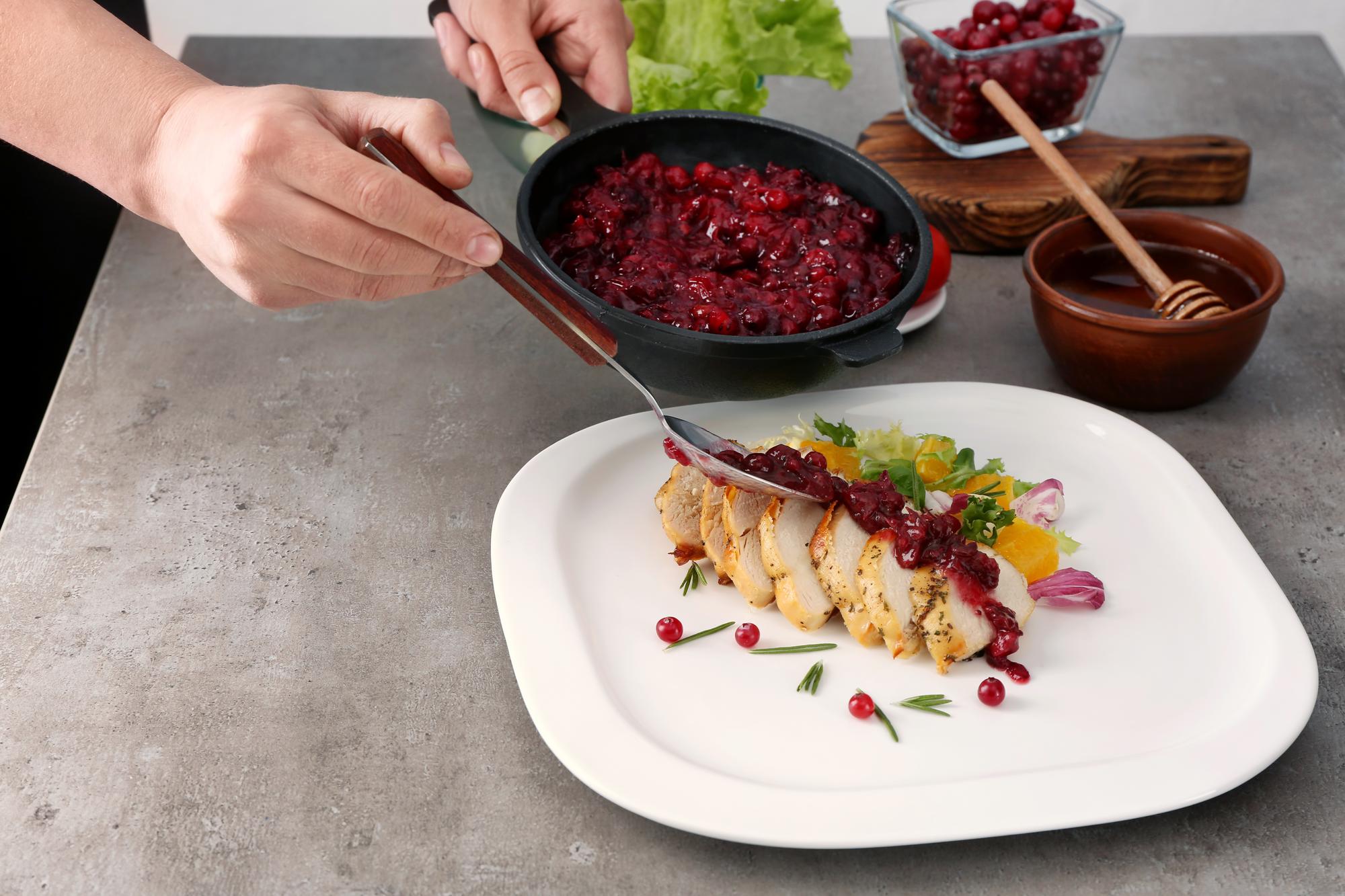 Chef arranging a simple seasonal dish on a ceramic plate