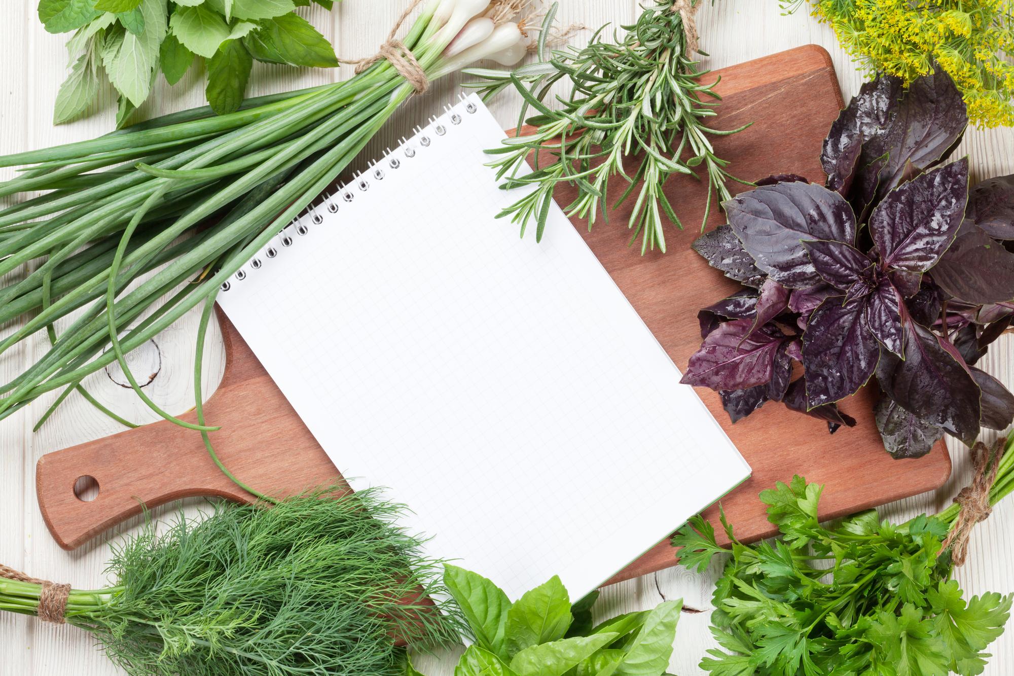 Flat lay of recipe cards and herbs